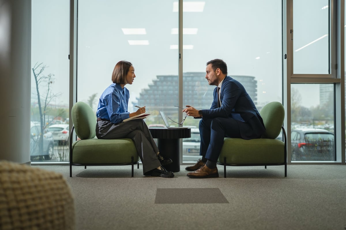 Two professionals in a focused consultation meeting